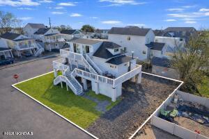 52 Washington Avenue Highlands, NJ 07732 - Photo 2 of 20 an aerial view of a house with a garden and lake view