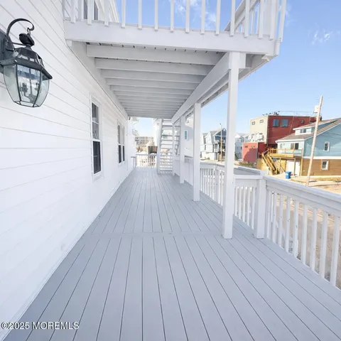 a view of a porch with wooden floor