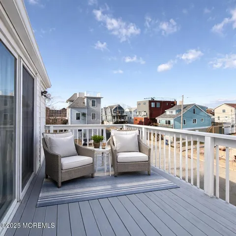 a view of a balcony with furniture