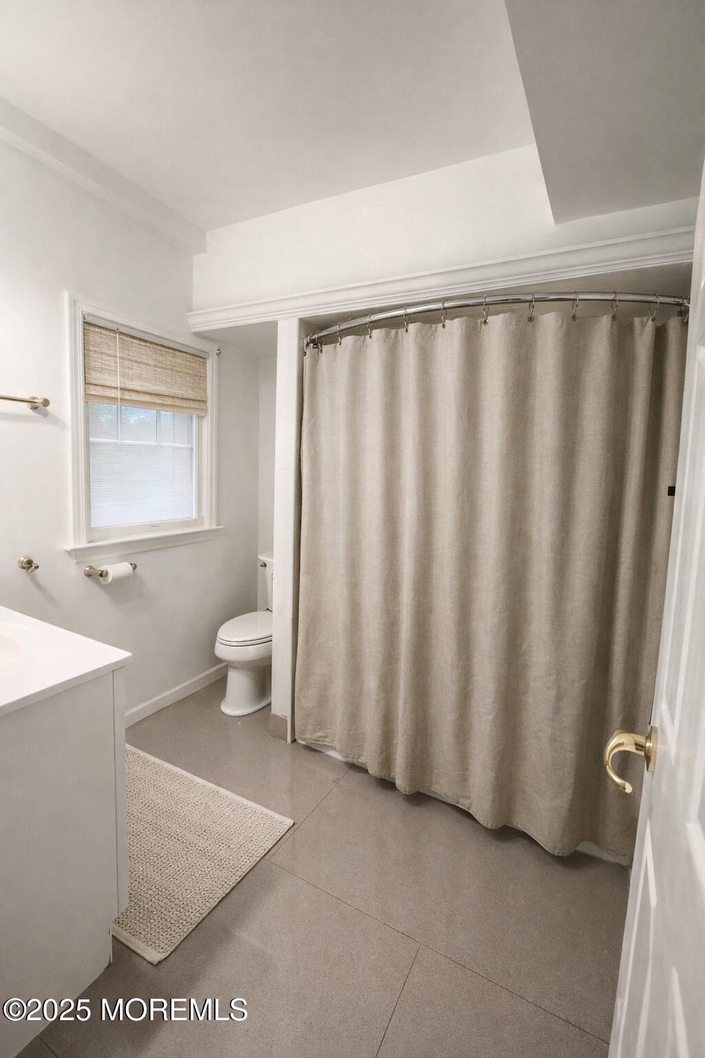52 Washington Avenue Highlands, NJ 07732 - Photo 9 of 20 a bathroom with a sink a toilet and a mirror