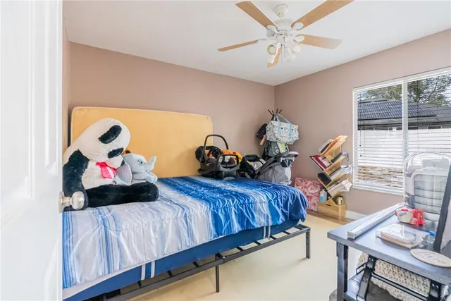 a bedroom with furniture and a window