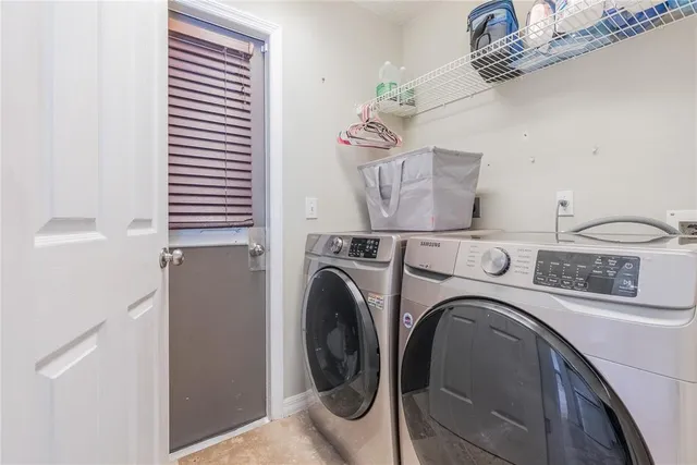 a utility room with dryer and washer