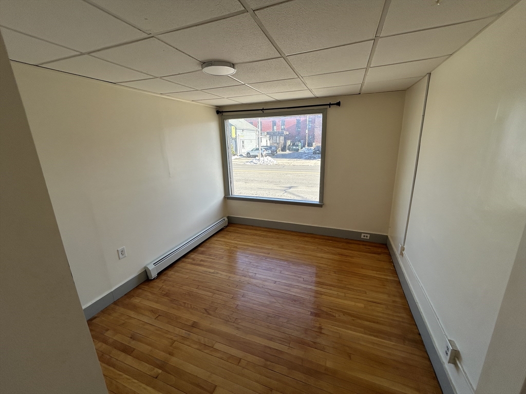 310 Park Worcester Ma, Unit 1 Worcester, MA 01609 - Photo 11 of 11 a view of room with window and wooden floor