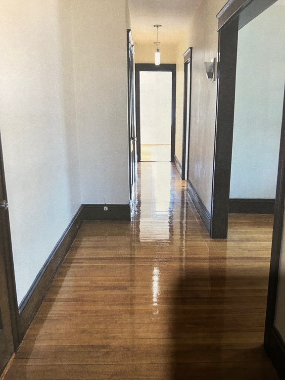310 Park Worcester Ma, Unit 1 Worcester, MA 01609 - Photo 2 of 11 a view of empty room with wooden floor and window