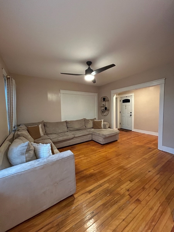 310 Park Worcester Ma, Unit 1 Worcester, MA 01609 - Photo 3 of 11 a living room with furniture and a wooden floor