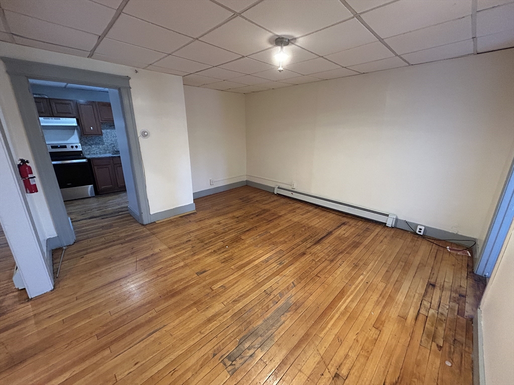 310 Park Worcester Ma, Unit 1 Worcester, MA 01609 - Photo 9 of 11 wooden floor in an empty room