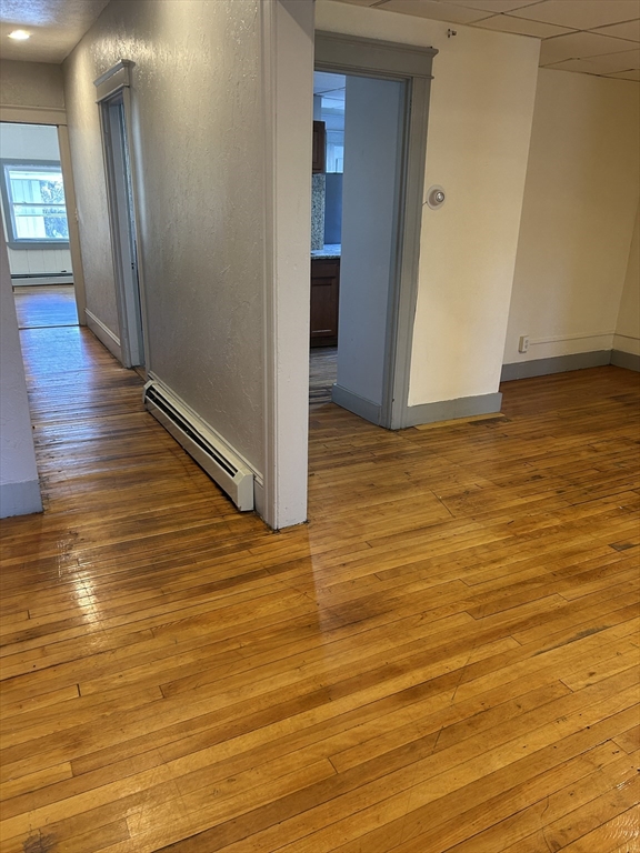 310 Park Worcester Ma, Unit 1 Worcester, MA 01609 - Photo 10 of 11 a view of an empty room with wooden floor