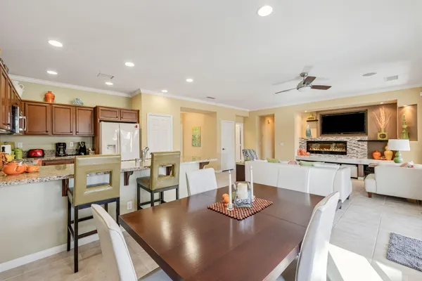 a view of kitchen with furniture and refrigerator