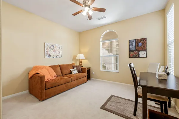 a bedroom with furniture and a window