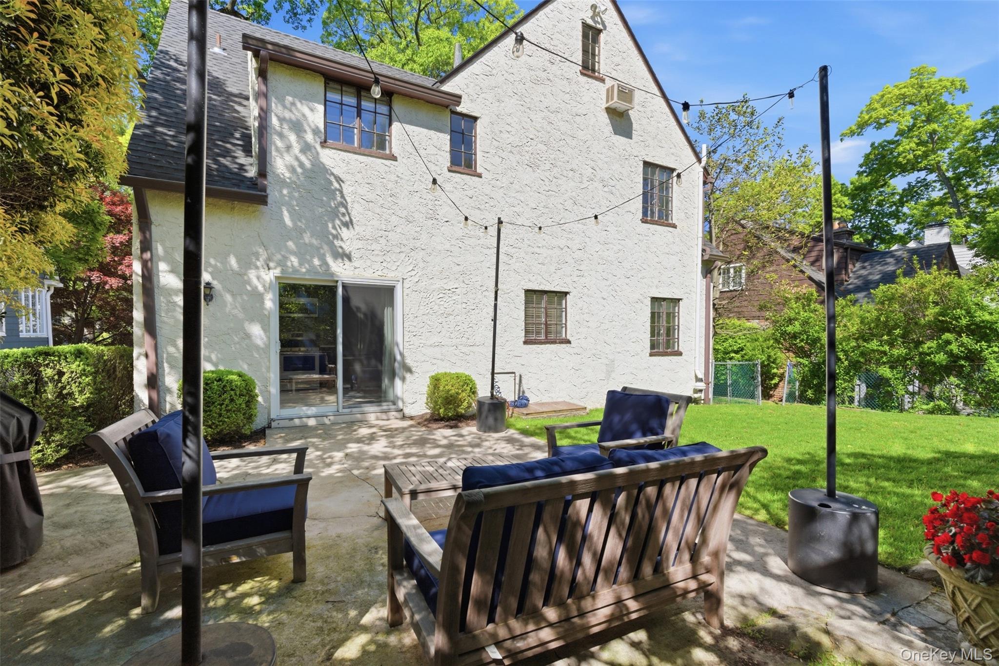 15 Kingsbury Road New Rochelle, NY 10804 - Photo 23 of 30 a view of a patio with chairs and table in a yard