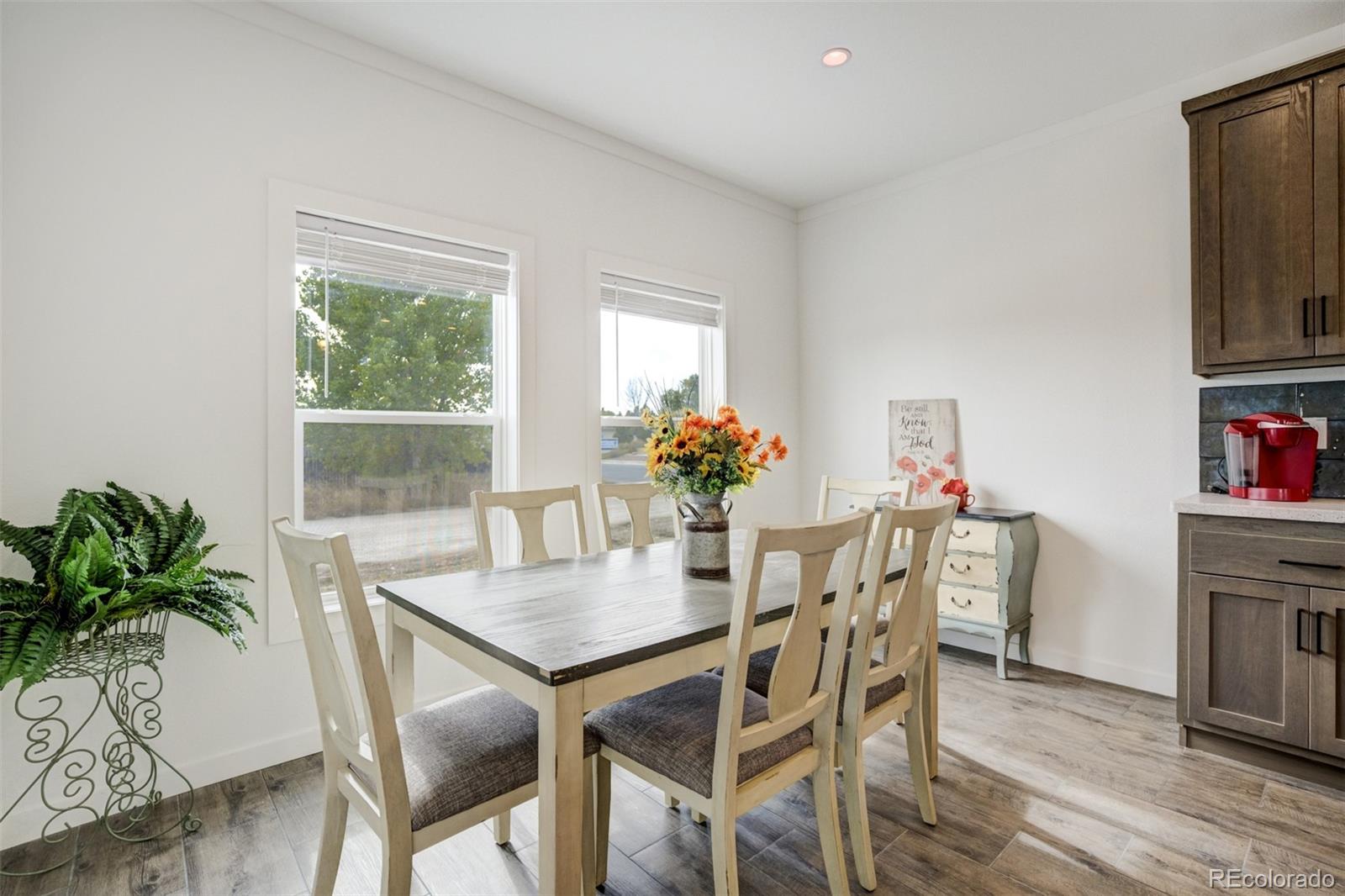 1684 9th Street Limon, CO 80828 - Photo 12 of 39 a dining room with furniture and wooden floor