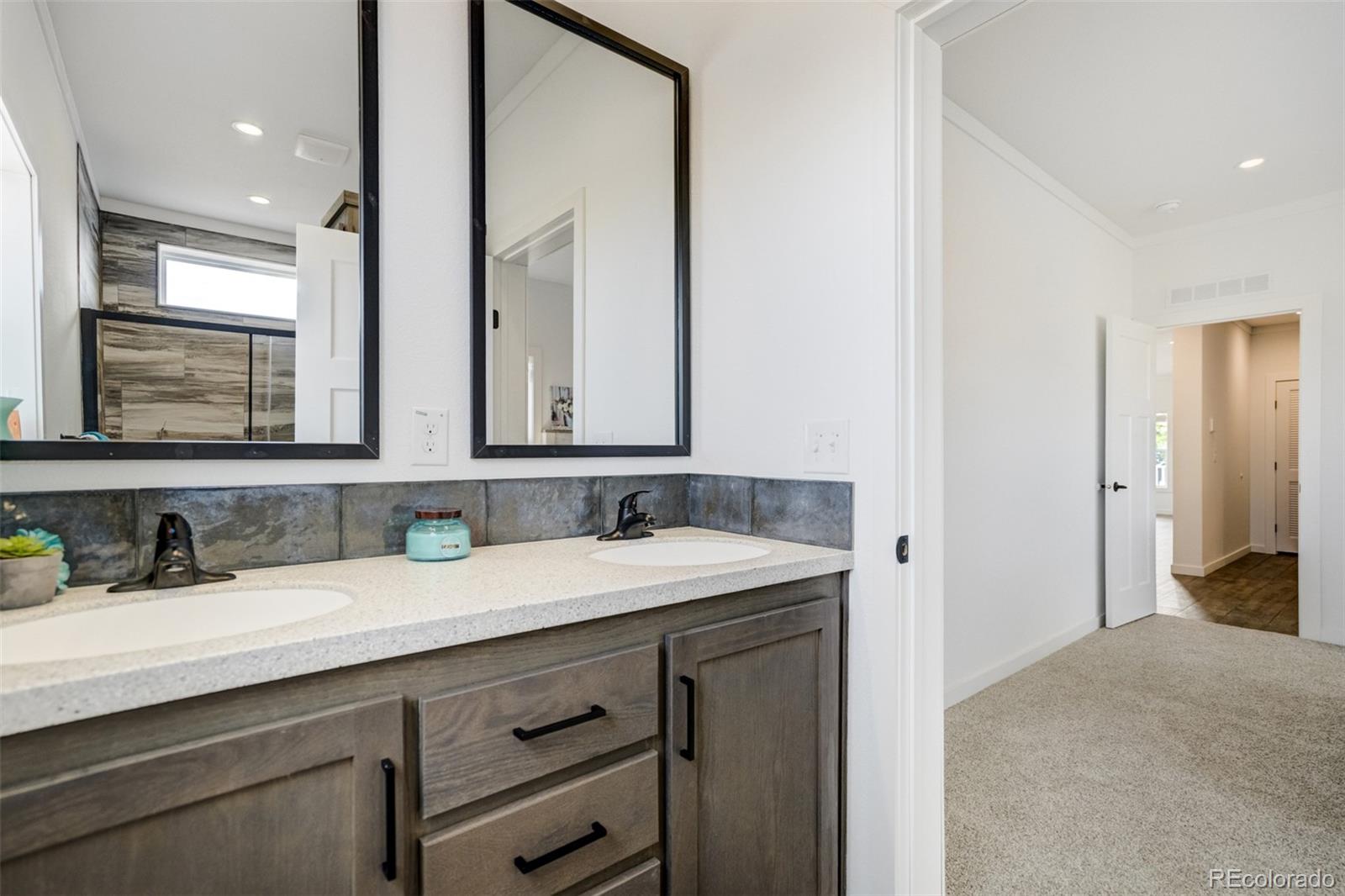 1684 9th Street Limon, CO 80828 - Photo 16 of 39 a bathroom with a sink and a mirror