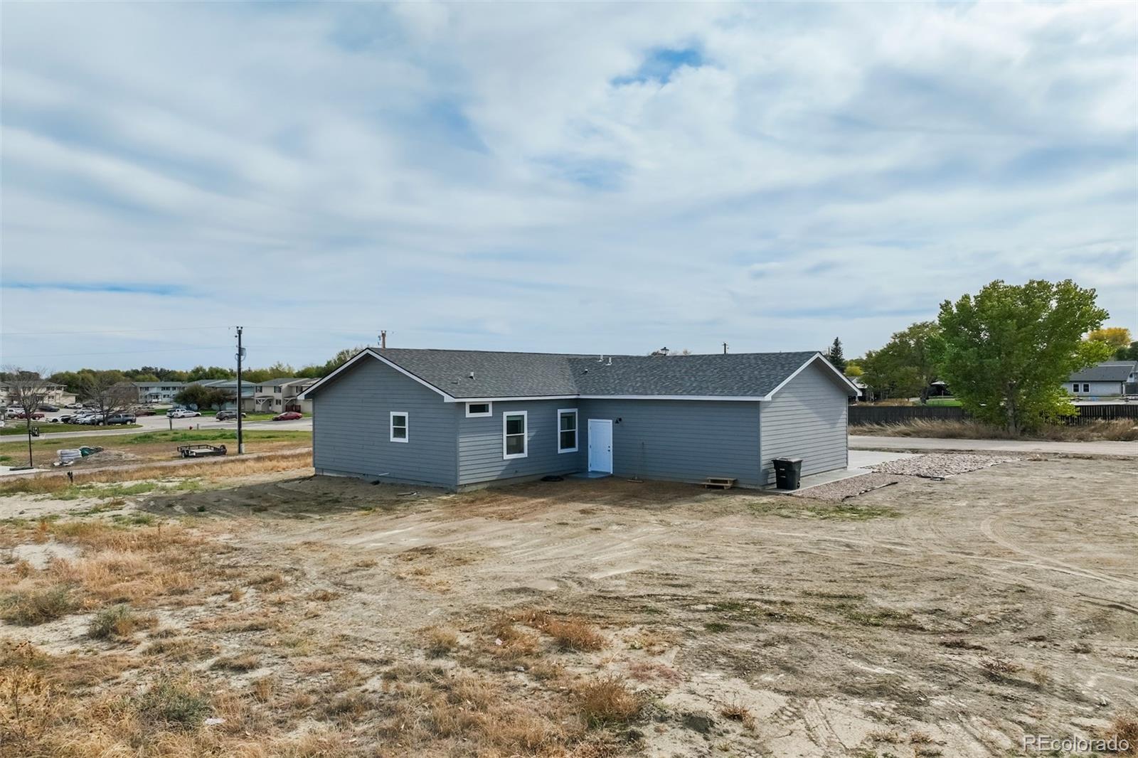 1684 9th Street Limon, CO 80828 - Photo 28 of 39 a view of a house with a yard