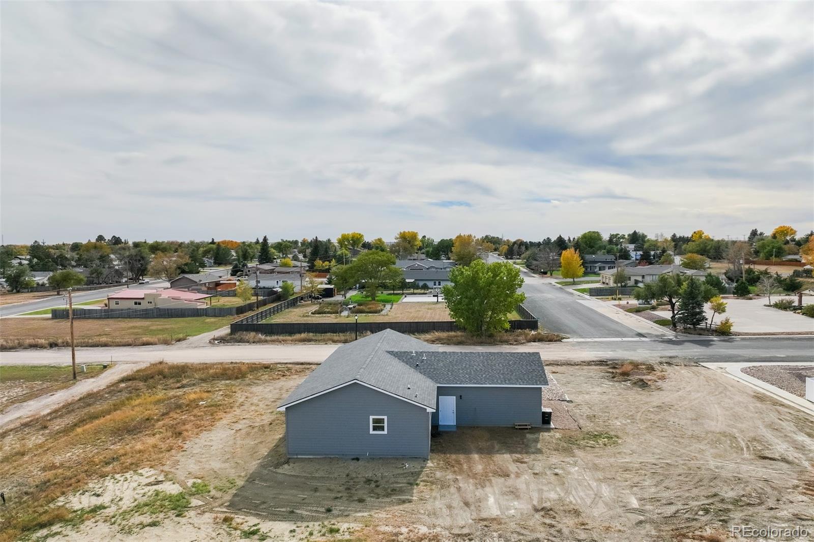 1684 9th Street Limon, CO 80828 - Photo 30 of 39 a view of a dry yard with wooden fence