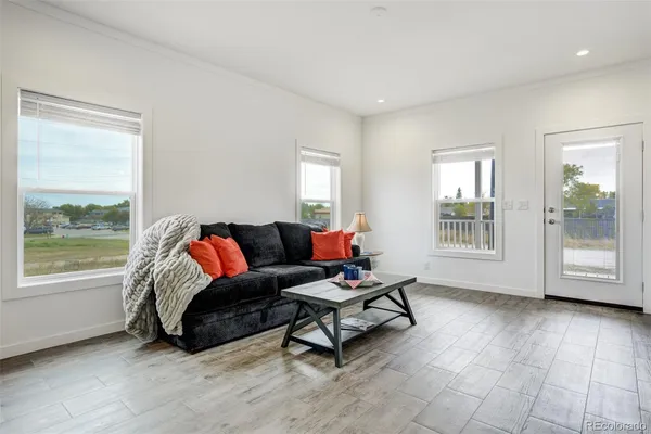 a living room with furniture and a window