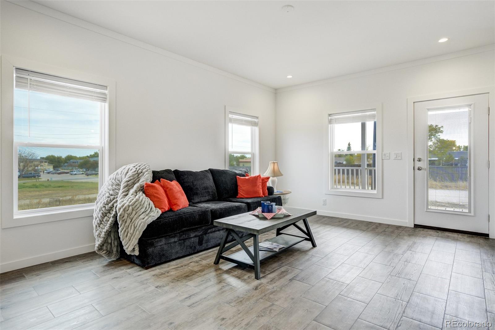 1684 9th Street Limon, CO 80828 - Photo 5 of 39 a living room with furniture and a window