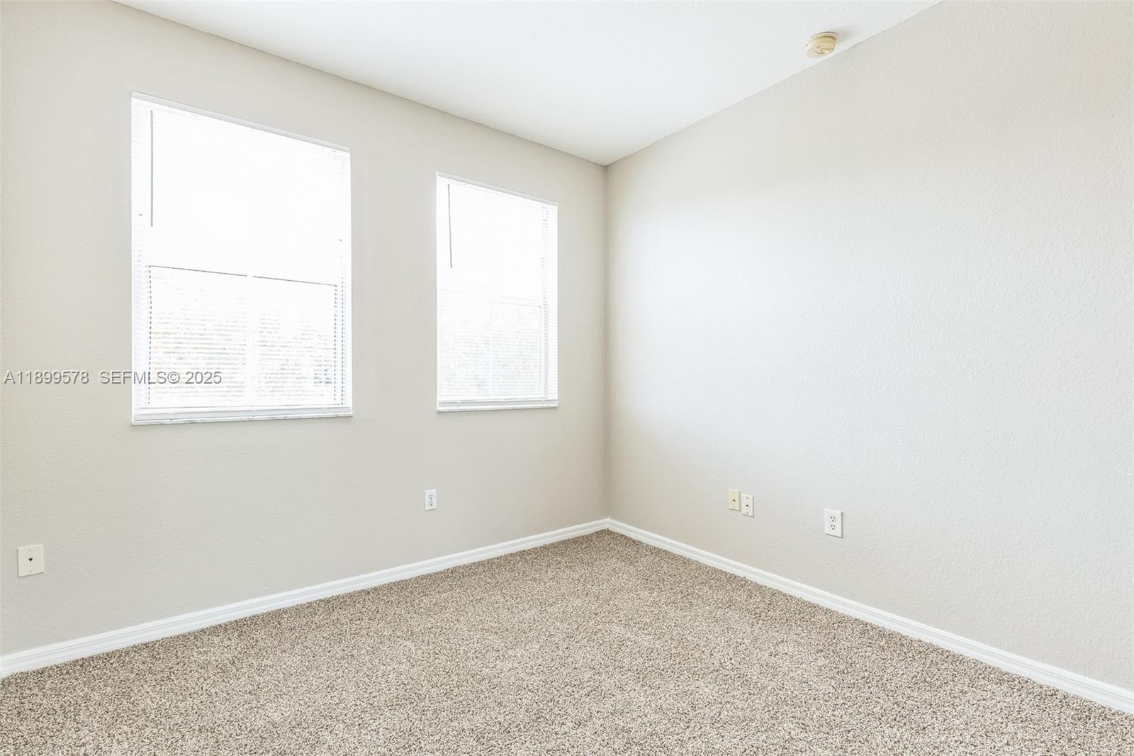 24066 Southwest 109th Court Homestead, FL 33032 - Photo 17 of 37 an empty room with a window