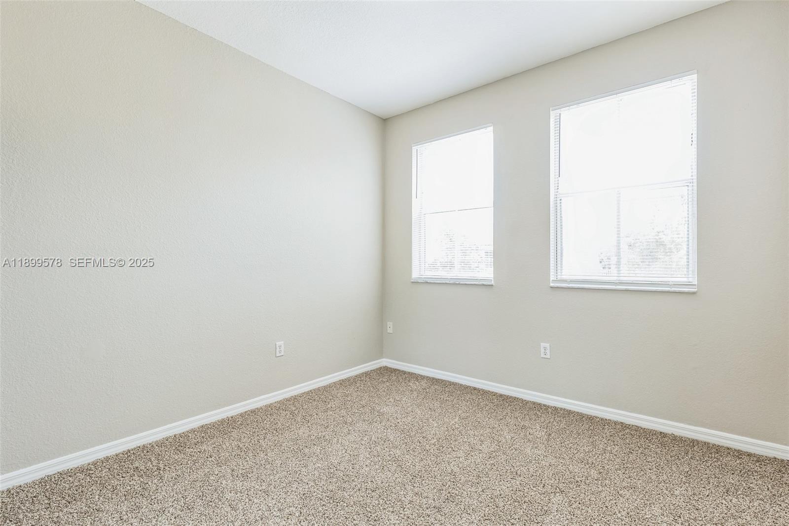 24066 Southwest 109th Court Homestead, FL 33032 - Photo 19 of 37 an empty room with a window