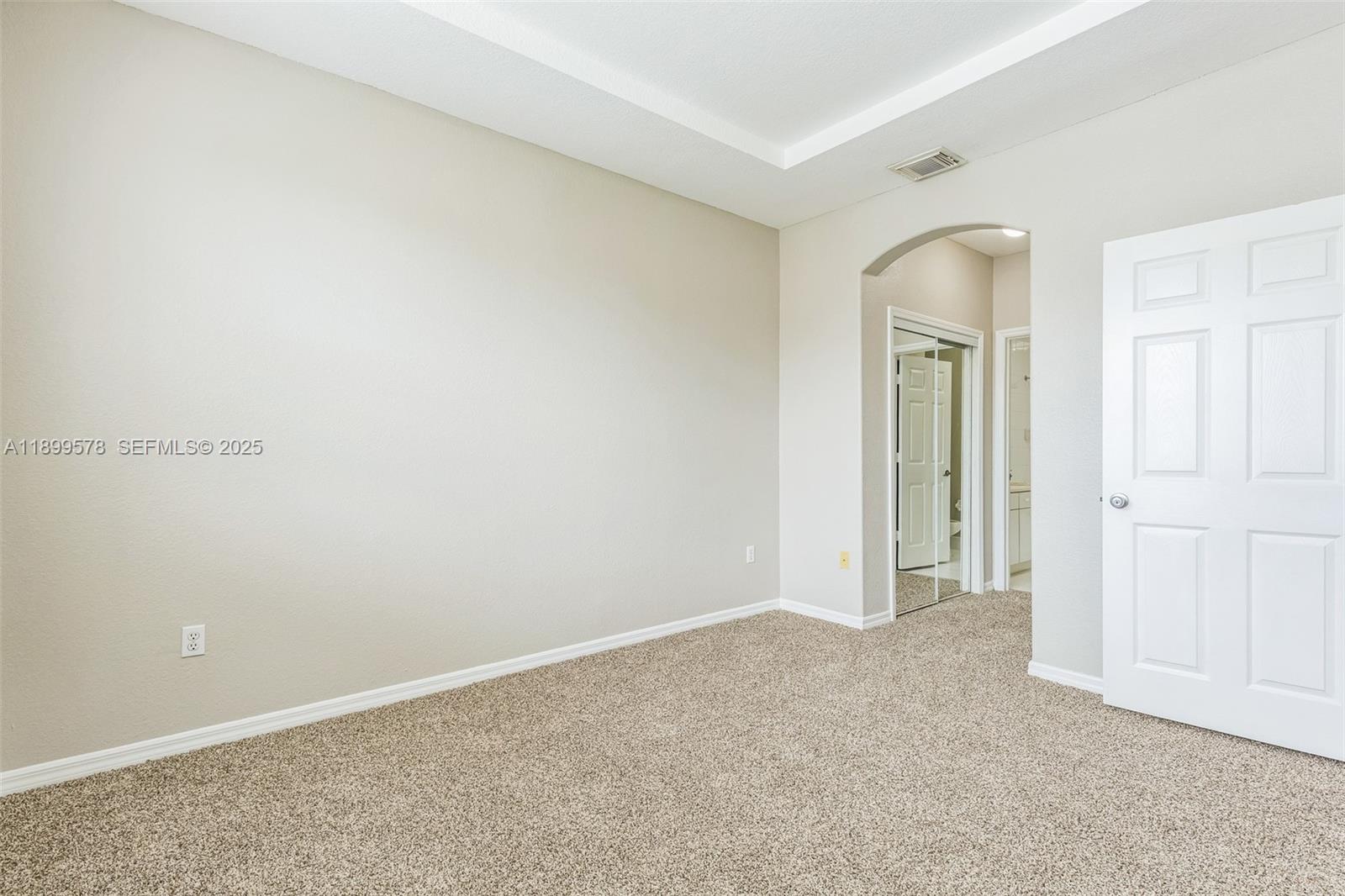 24066 Southwest 109th Court Homestead, FL 33032 - Photo 21 of 37 an empty room with closet and mirror
