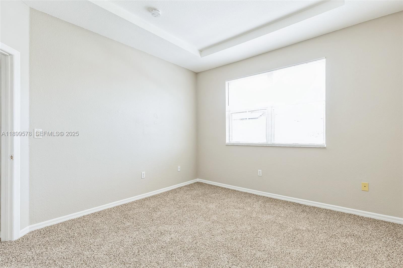24066 Southwest 109th Court Homestead, FL 33032 - Photo 28 of 37 an empty room with a window