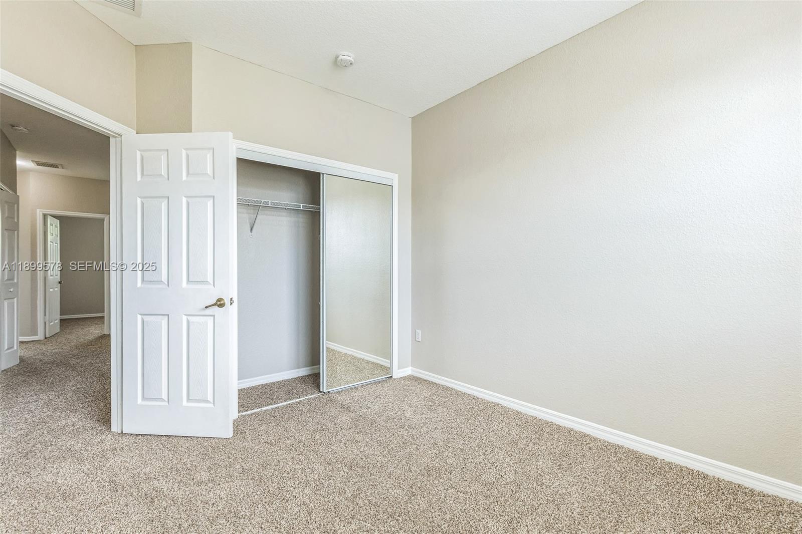 24066 Southwest 109th Court Homestead, FL 33032 - Photo 31 of 37 an empty room with closet area