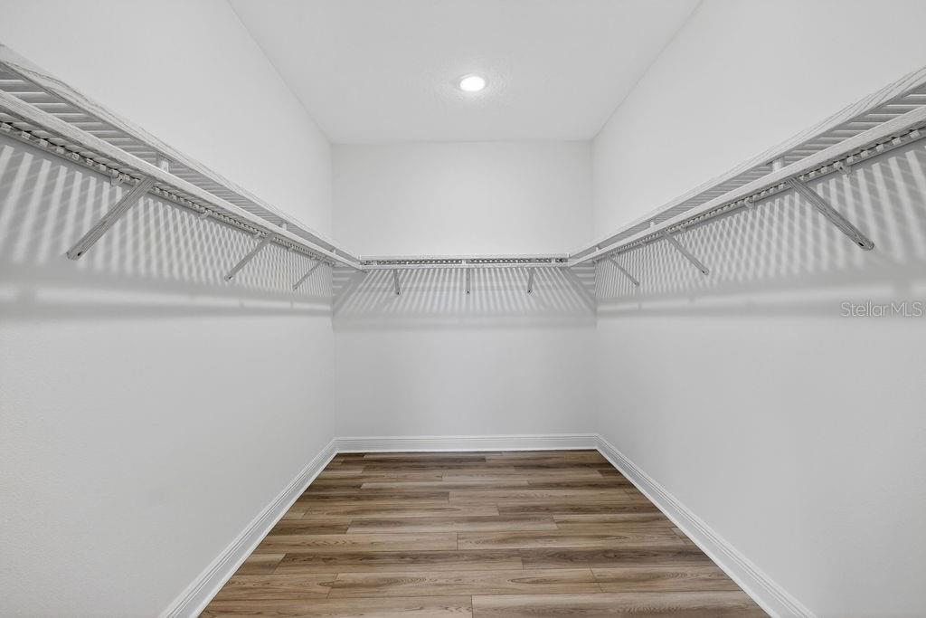 3951 Kennebunk Loop Mount Dora, FL 32757 - Photo 20 of 51 a view of a hallway with stairs and a wooden floor