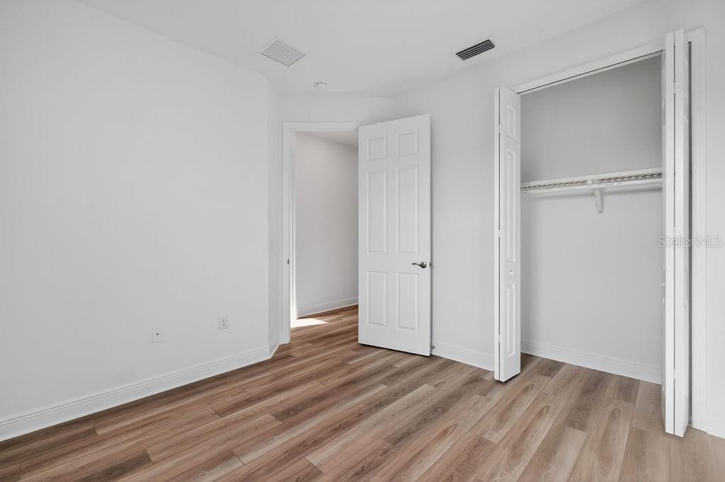 3951 Kennebunk Loop Mount Dora, FL 32757 - Photo 26 of 51 a view of an empty room with wooden floor