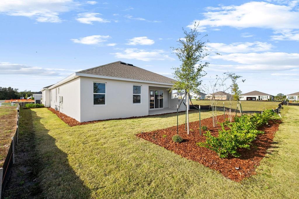 3951 Kennebunk Loop Mount Dora, FL 32757 - Photo 35 of 51 a house view with a garden space