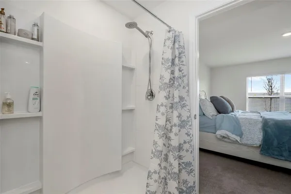 a bedroom with a bed and a couch