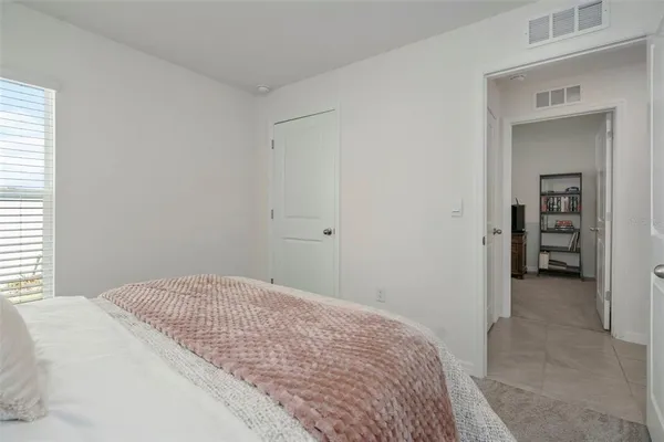a bedroom with a bed and closet