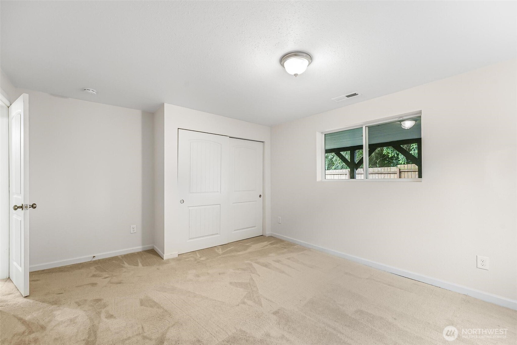 11404 Karshner Road East Edgewood, WA 98372 - Photo 32 of 40 an empty room with windows
