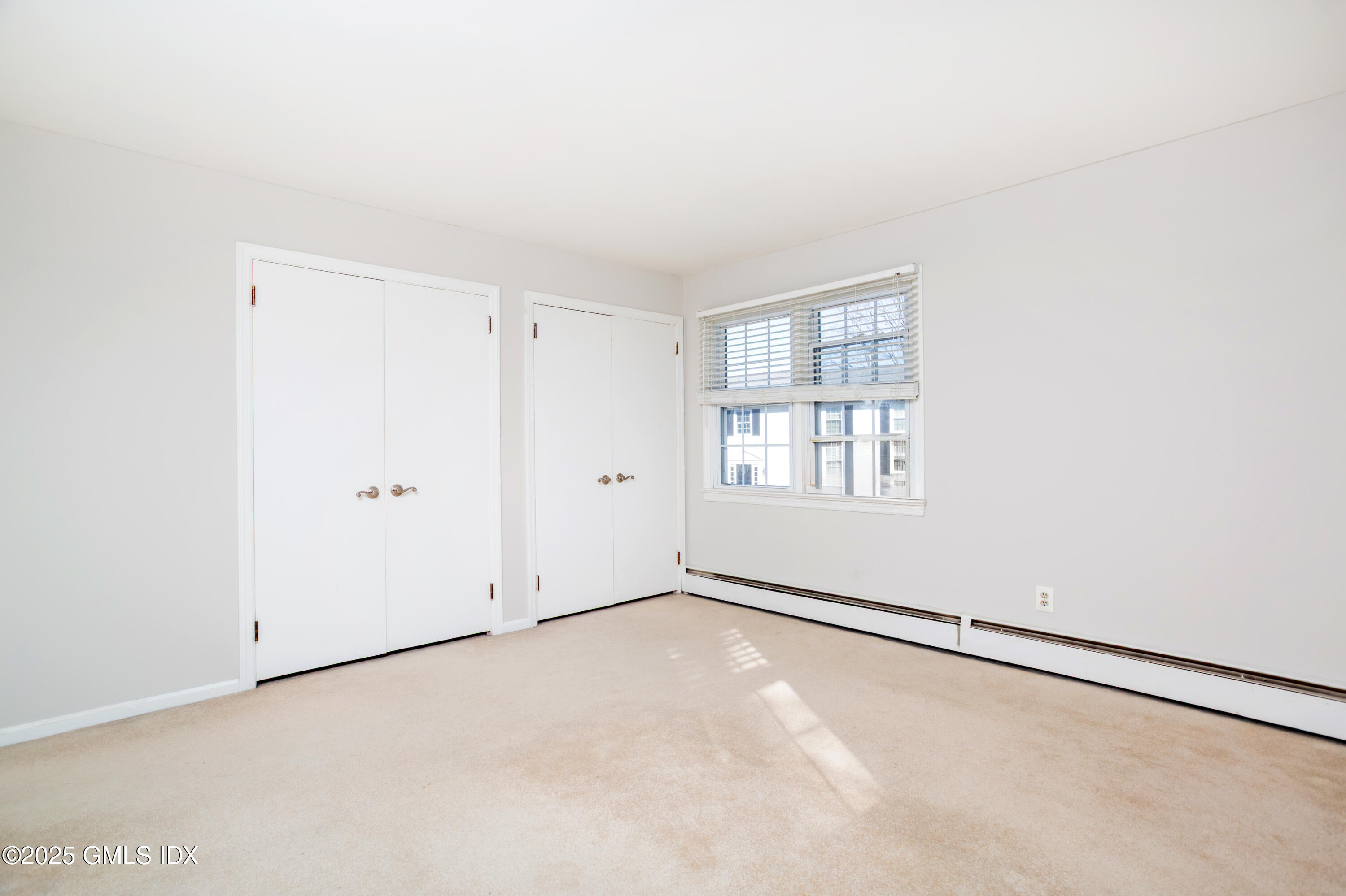 47 Valley Road, Unit B3 Cos Cob, CT 06807 - Photo 13 of 17 an empty room with windows
