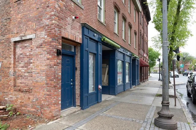 a view of a brick building with many windows