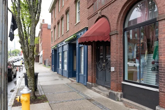a view of shops on a street