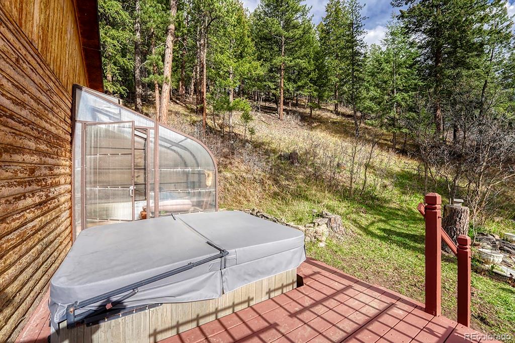 9088 South Murphy Gulch Road Littleton, CO 80127 - Photo 11 of 50 a balcony with view of trees