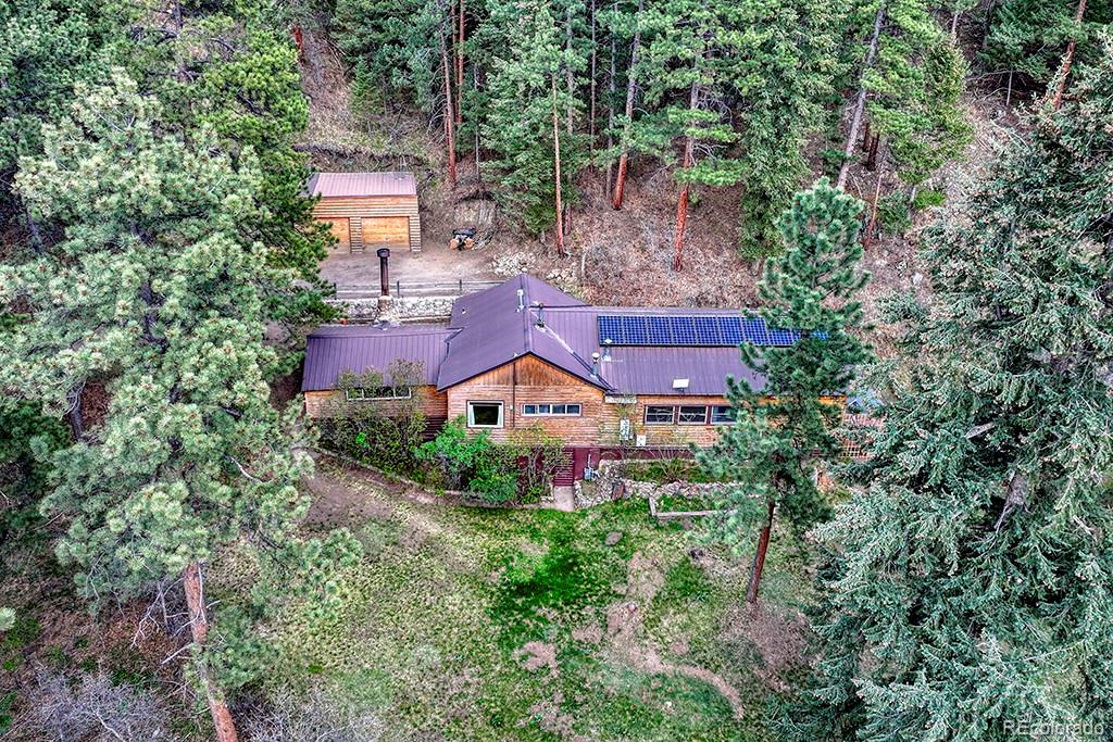 9088 South Murphy Gulch Road Littleton, CO 80127 - Photo 17 of 50 an aerial view of a house by greenery space and a street view