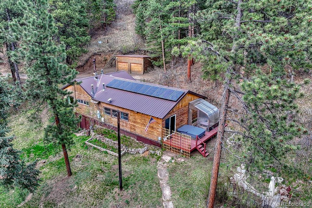 9088 South Murphy Gulch Road Littleton, CO 80127 - Photo 18 of 50 an aerial view of a house with a yard