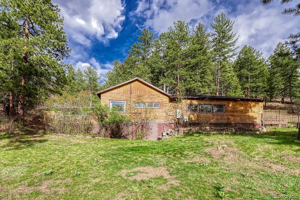 9088 South Murphy Gulch Road Littleton, CO 80127 - Photo 6 of 50 a view of a back yard of the house