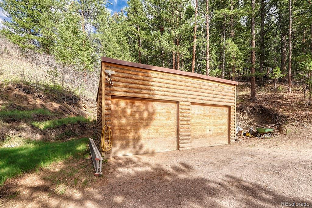 9088 South Murphy Gulch Road Littleton, CO 80127 - Photo 10 of 50 a view of a house with a backyard
