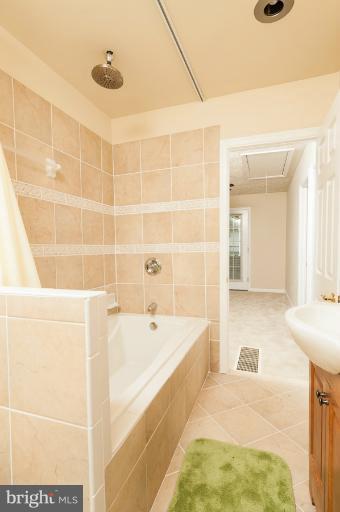 1319 3rd Road Baltimore, MD 21220 - Photo 15 of 29 a bathroom with a bathtub and a shower