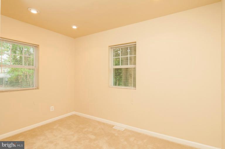 1319 3rd Road Baltimore, MD 21220 - Photo 22 of 29 an empty room with windows