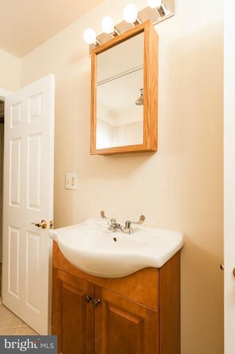 1319 3rd Road Baltimore, MD 21220 - Photo 24 of 29 a bathroom with a sink and a mirror
