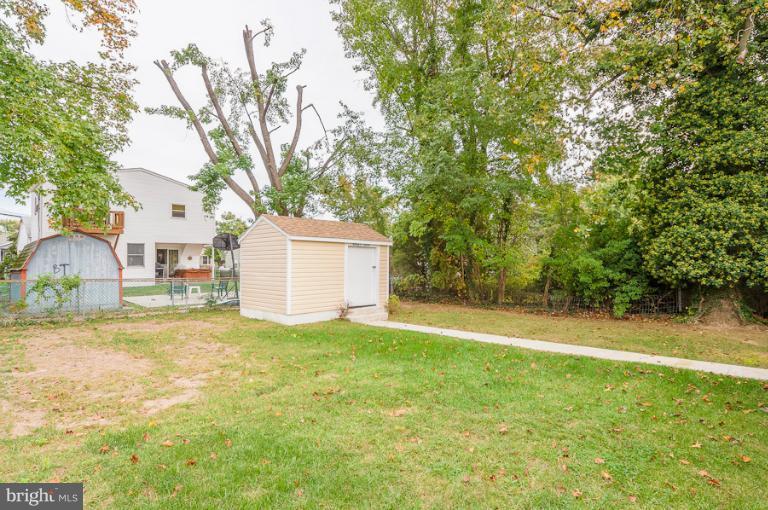 1319 3rd Road Baltimore, MD 21220 - Photo 28 of 29 a house with trees in front of it