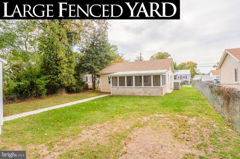 1319 3rd Road Baltimore, MD 21220 - Photo 8 of 29 a view of a house with backyard and trees