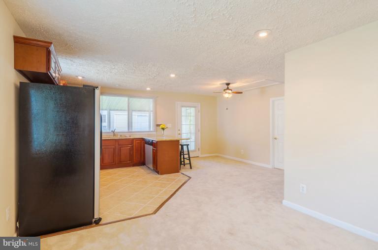 1319 3rd Road Baltimore, MD 21220 - Photo 9 of 29 a view of a kitchen with refrigerator and a sink