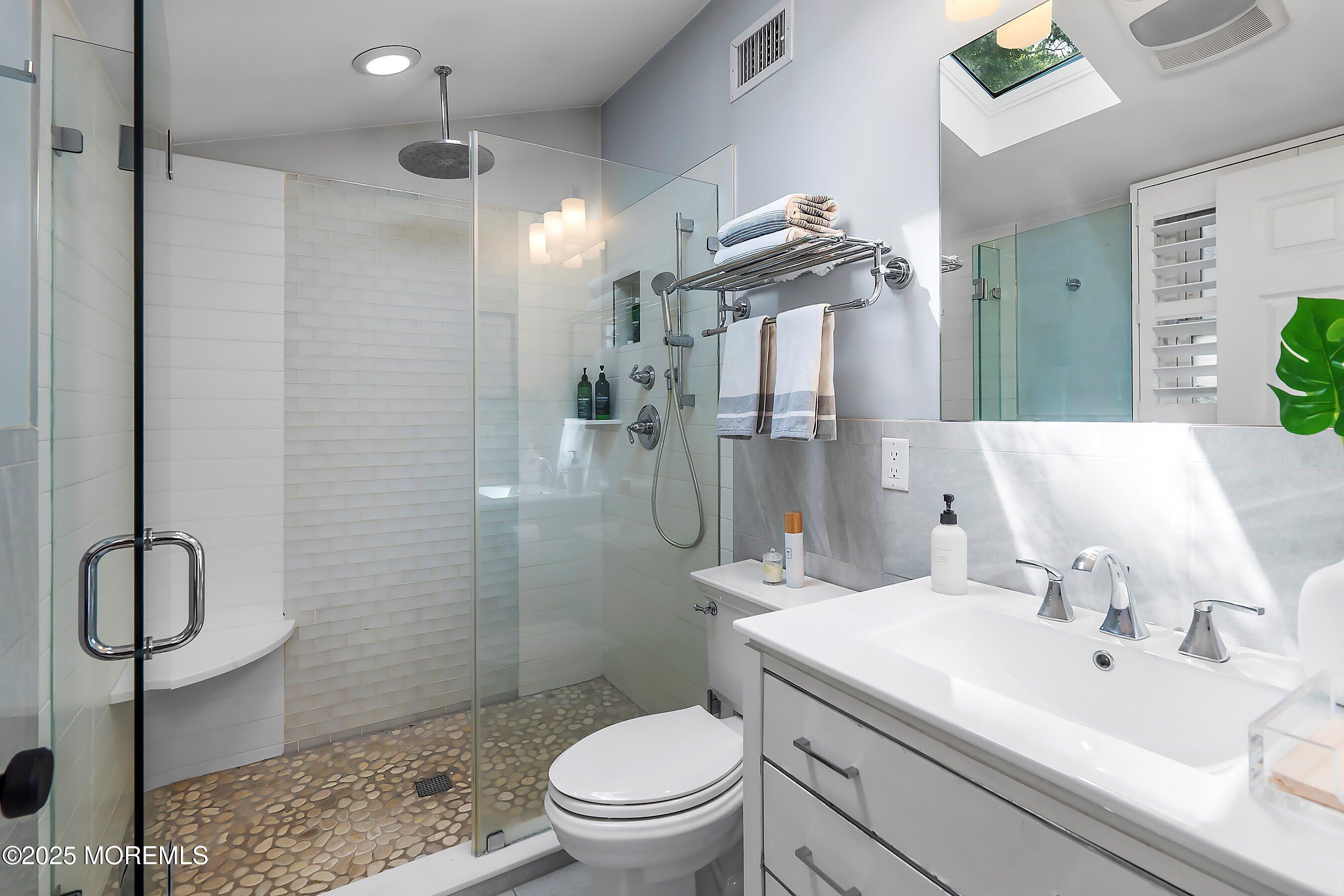 44 Ridge Road Rumson, NJ 07760 - Photo 14 of 38 a bathroom with a sink toilet and shower