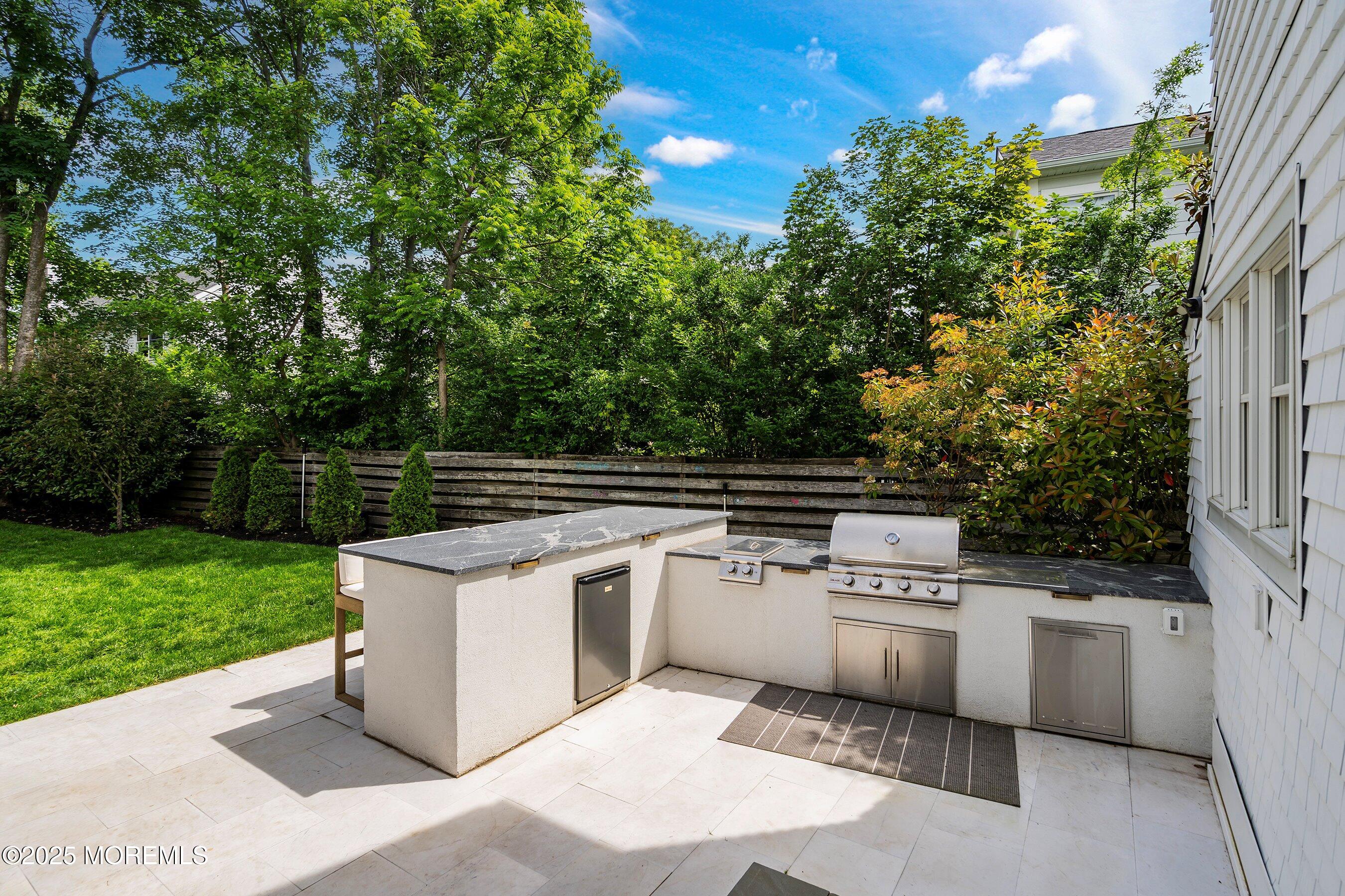 44 Ridge Road Rumson, NJ 07760 - Photo 18 of 38 a view of a kitchen with a sink and dishwasher