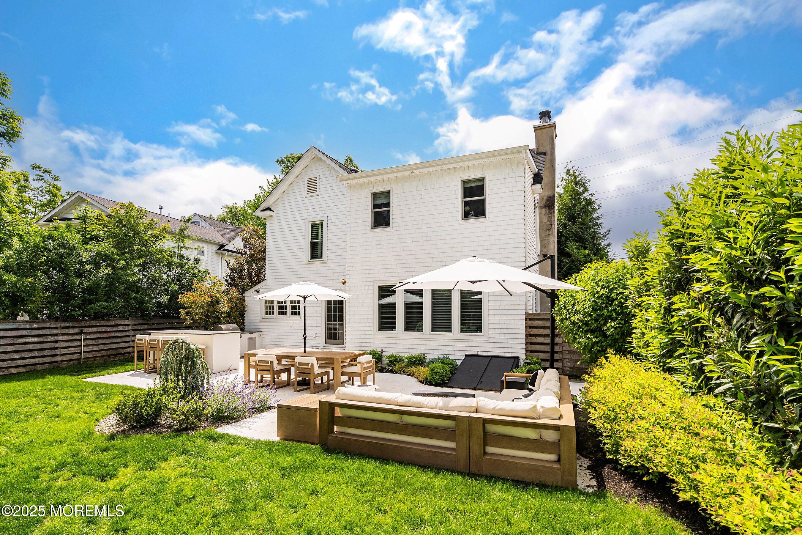 44 Ridge Road Rumson, NJ 07760 - Photo 32 of 38 a front view of a house with a yard