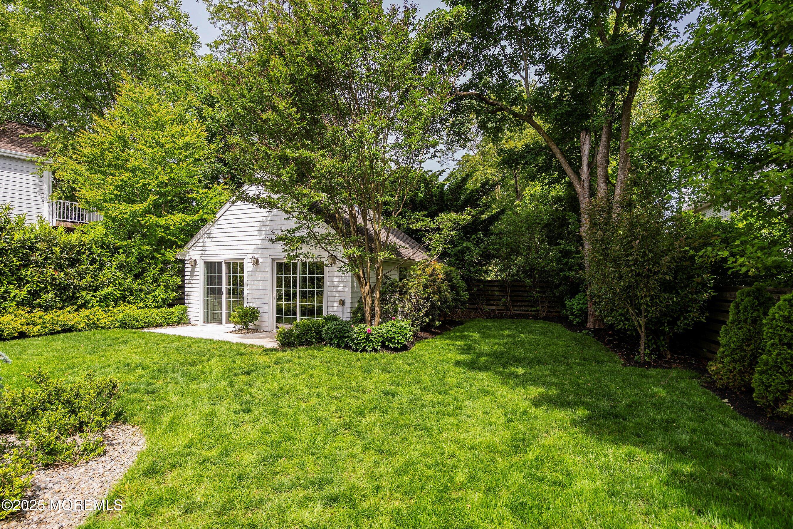 44 Ridge Road Rumson, NJ 07760 - Photo 34 of 38 a front view of house with yard and green space