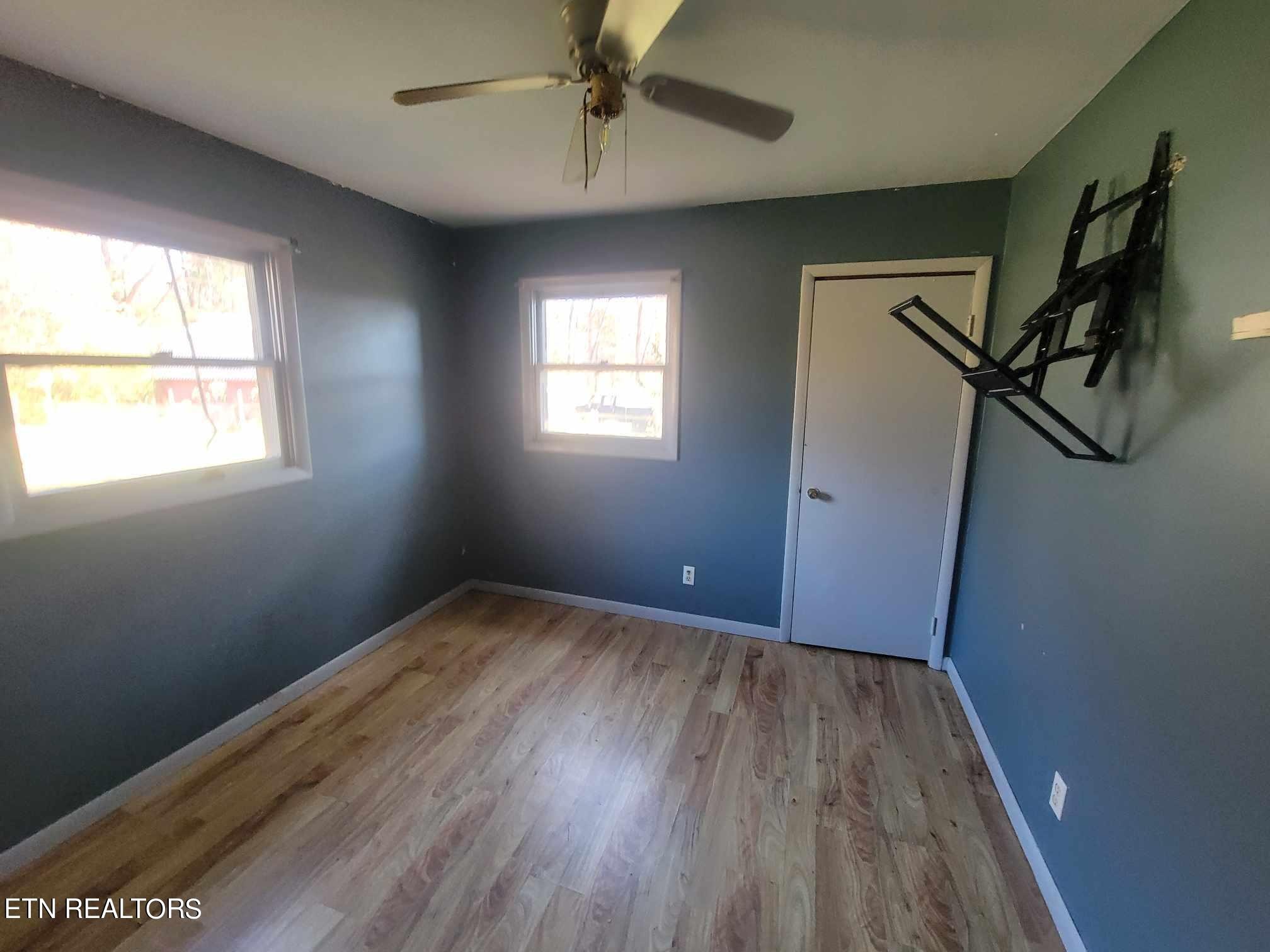 1751 Eldridge Loop Crossville, TN 38571 - Photo 11 of 35 a view of empty room with wooden floor and fan